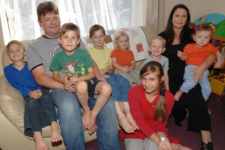 Tania and Mike Sullivan at home with some of their children