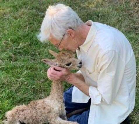 Paul O'Grady with his newborn alpaca (63257390)