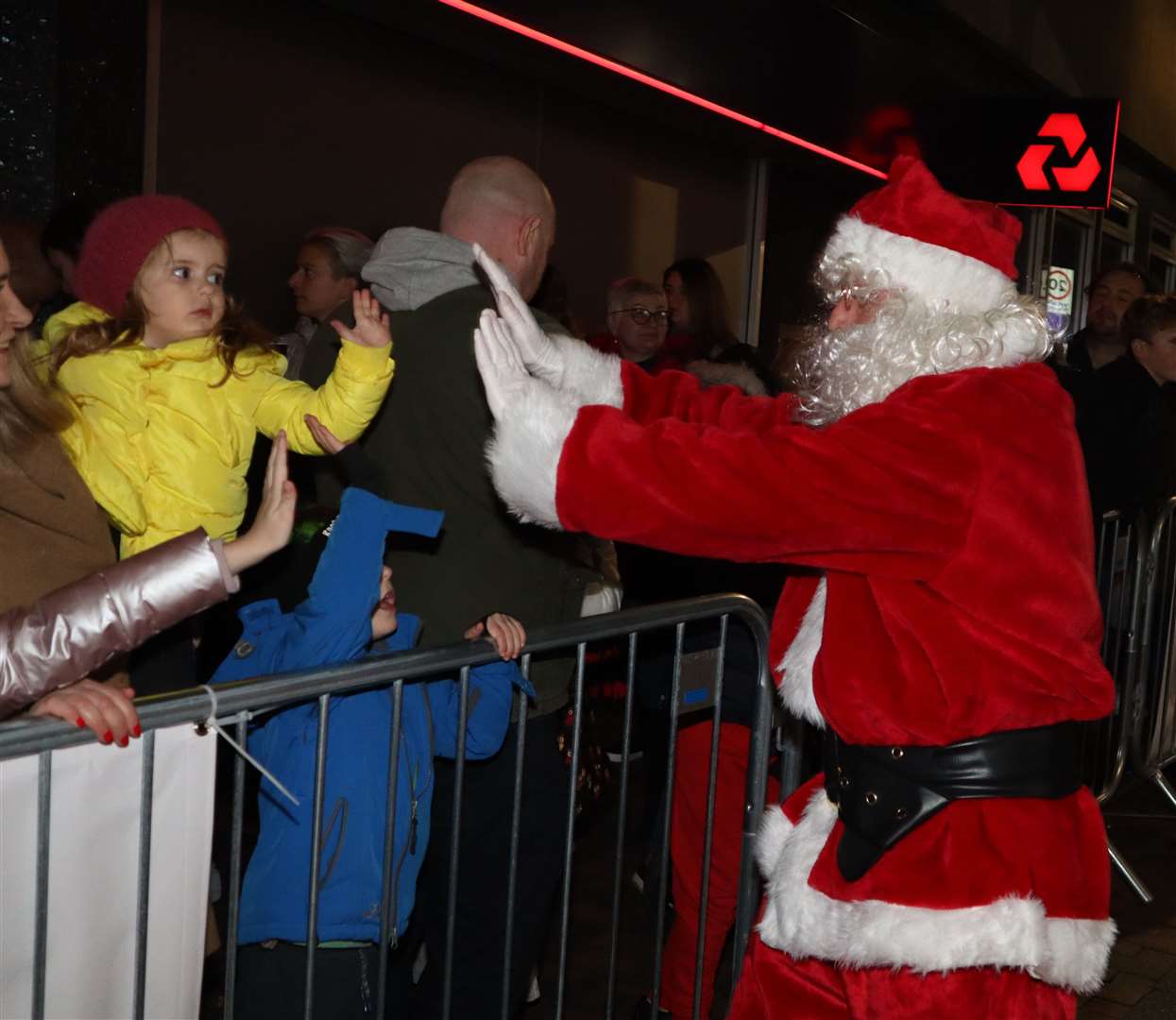 Santa high-fiving the crowd at the Sittingbourne Christmas lights switch-on