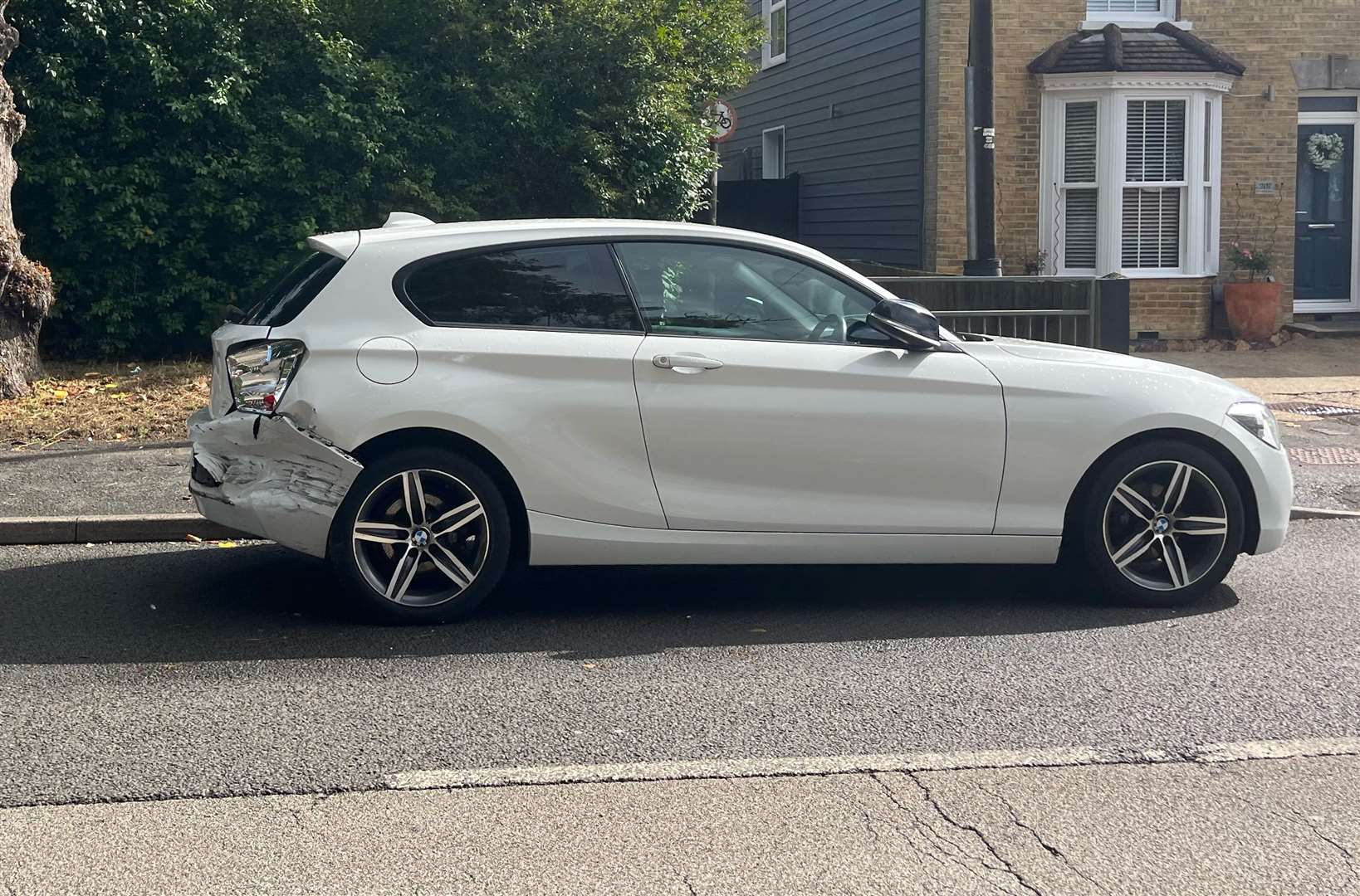 A white BMW was damaged recently