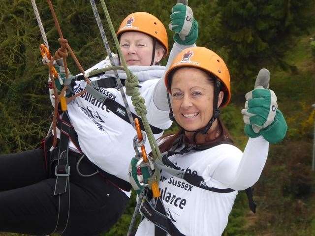 The KM Charity Team will reschedule its abseil challenge after strong winds caused Sunday's event to be cancelled.
