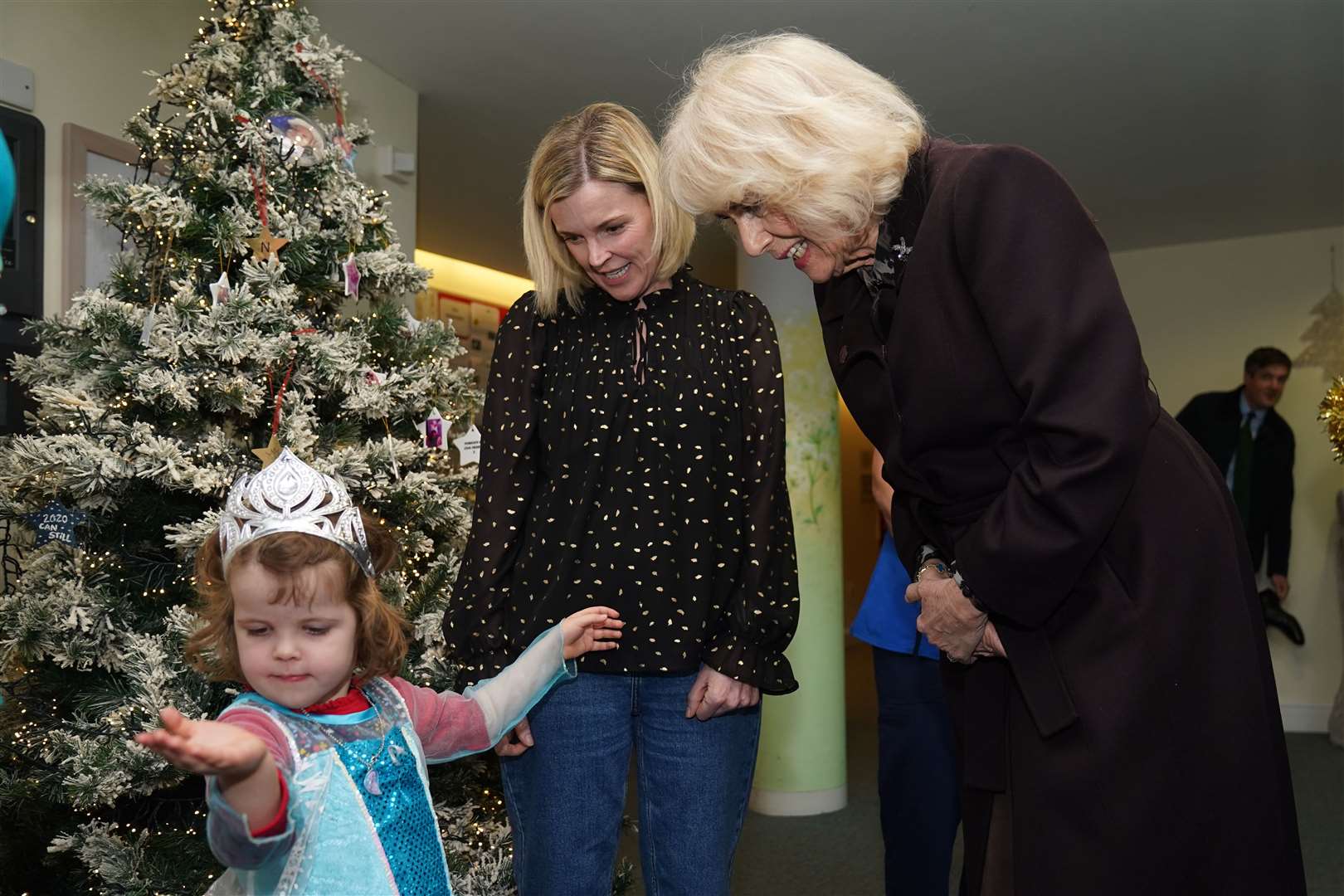 Camilla meets Kitty Jones who was dressed as Elsa from Frozen (Jacob King/PA)