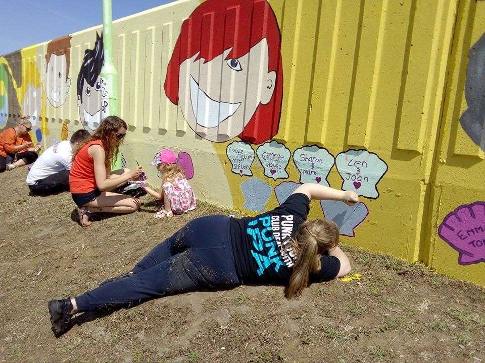 Lying down on the job painting Richard Jeferies' seawall mural in Beachfields, Sheerness. Picture: Richard Jeferies (12911013)