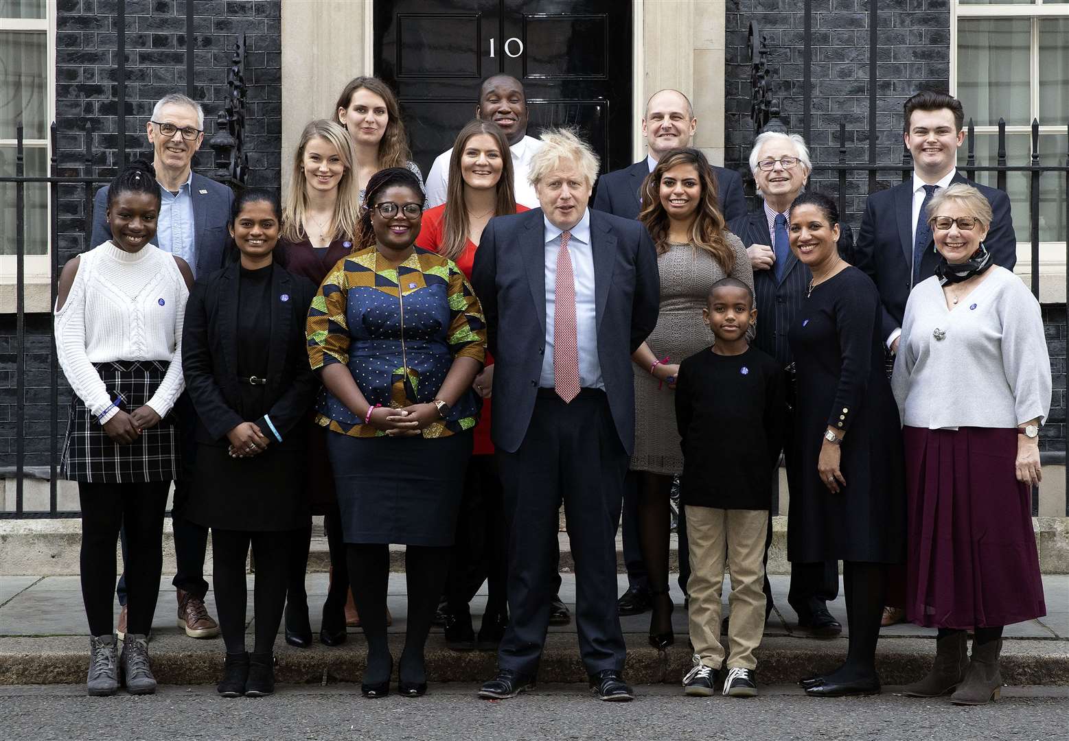 Josh Harrison and his mum, pictured second and third from the right in front row, travelled with Cancer Research UK campaigners to meet Boris Johnson. Picture: ©No10 Crown