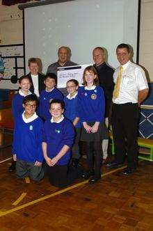 Head teacher Pauline Shipley, Richard Gipp, John Stanford, Ken Saunders and some of the pupils from Eastchurch school