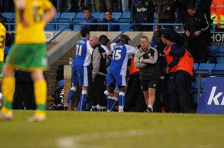 Jackson is mobbed by his team mates on the Gills bench.