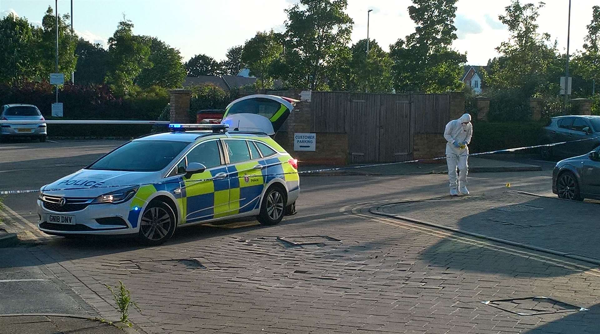 Police and forensics in the car park next to The Jenny Wren pub near Sittingbourne