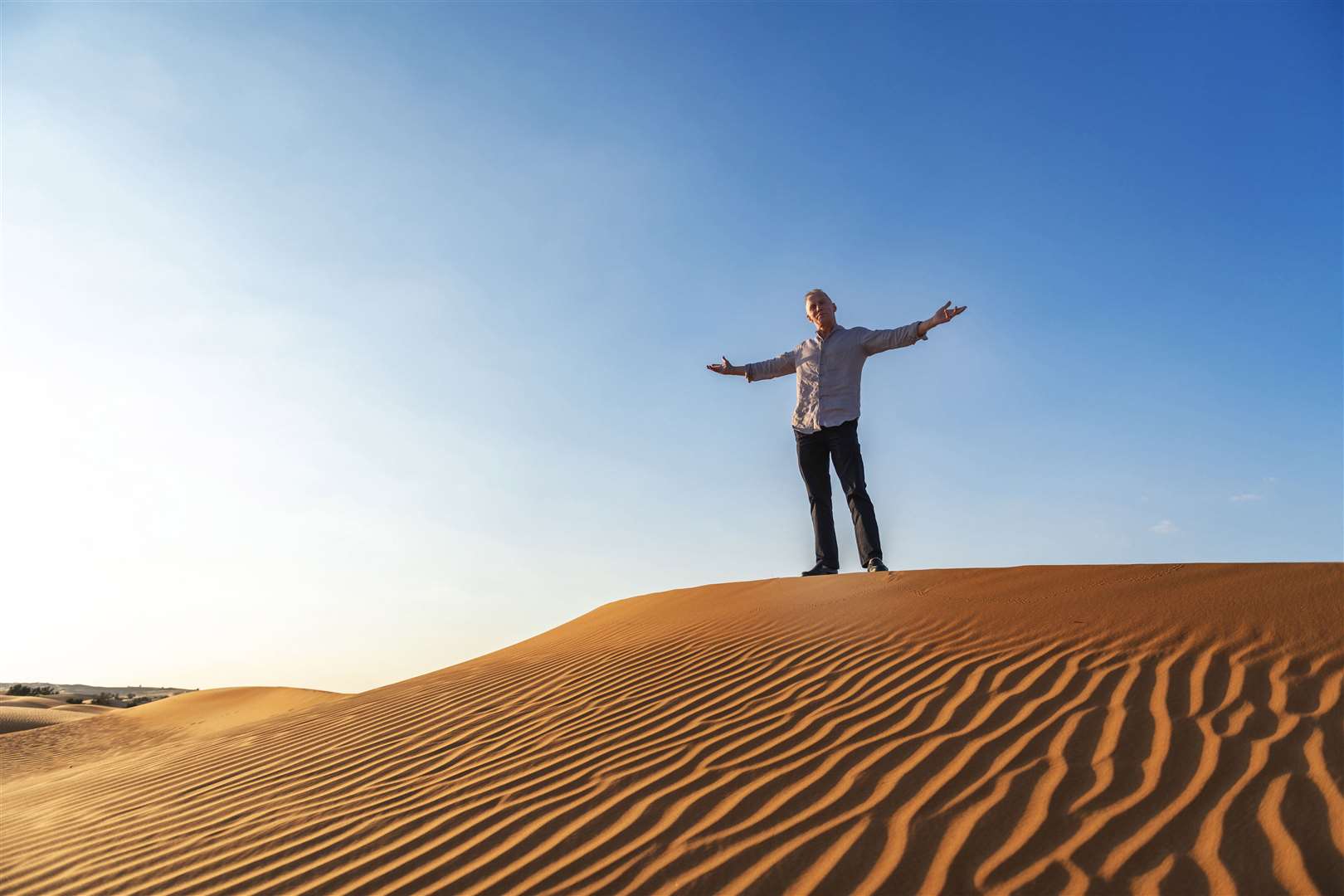 Gary Rhodes pictured on top of a sand dune in Dubai on the day he collapsed last year. Picture: ITV (29207280)