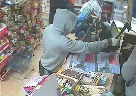 Robbers threaten a shopkeeper with an axe during a robbery in Victoria Road, Margate