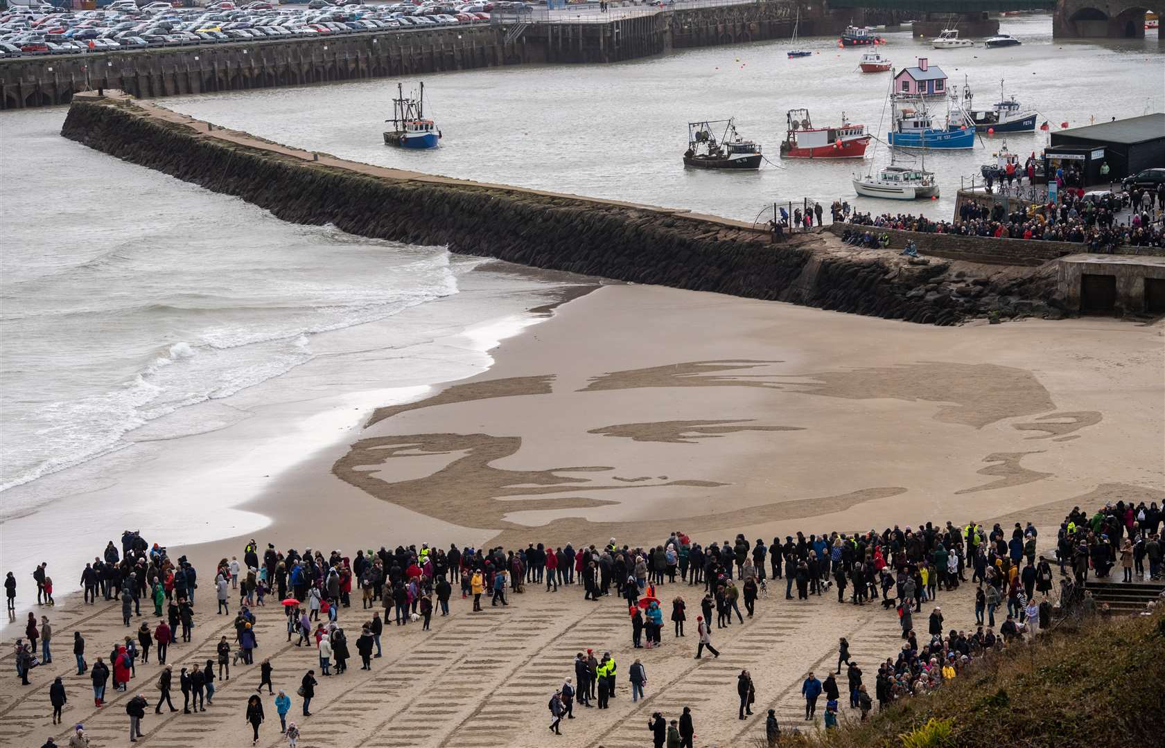 Wilfred Owen's portrait on the beach. Picture: Getty Images/ Chris J Ratcliffe