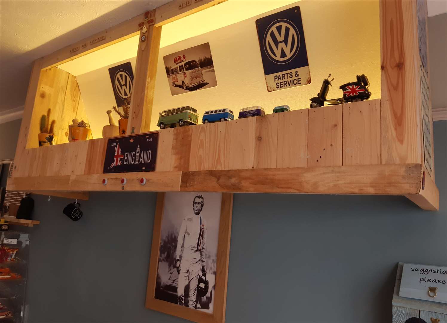 A photo of Steve McQueen in his famous Le Mans film adorns a wall