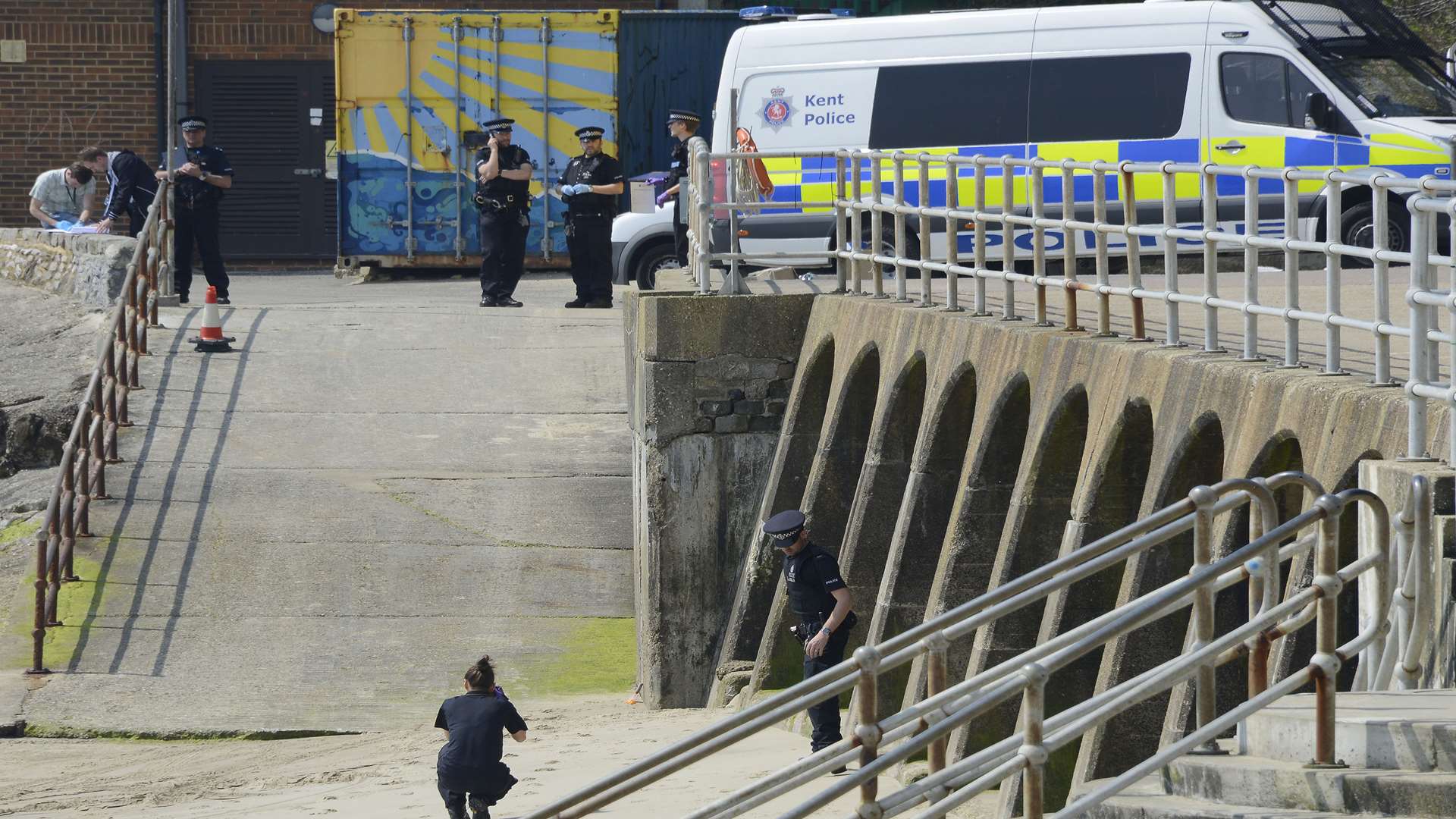 Police at Sunny Sands beach, Folkestone, after the body was found last week.