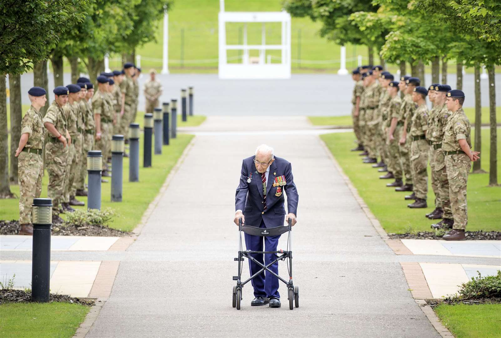 Captain Sir Tom Moore walking down a guard of honour during a visit to the Army Foundation College in Harrogate, where he was made an Honorary Colonel (Danny Lawson/PA)