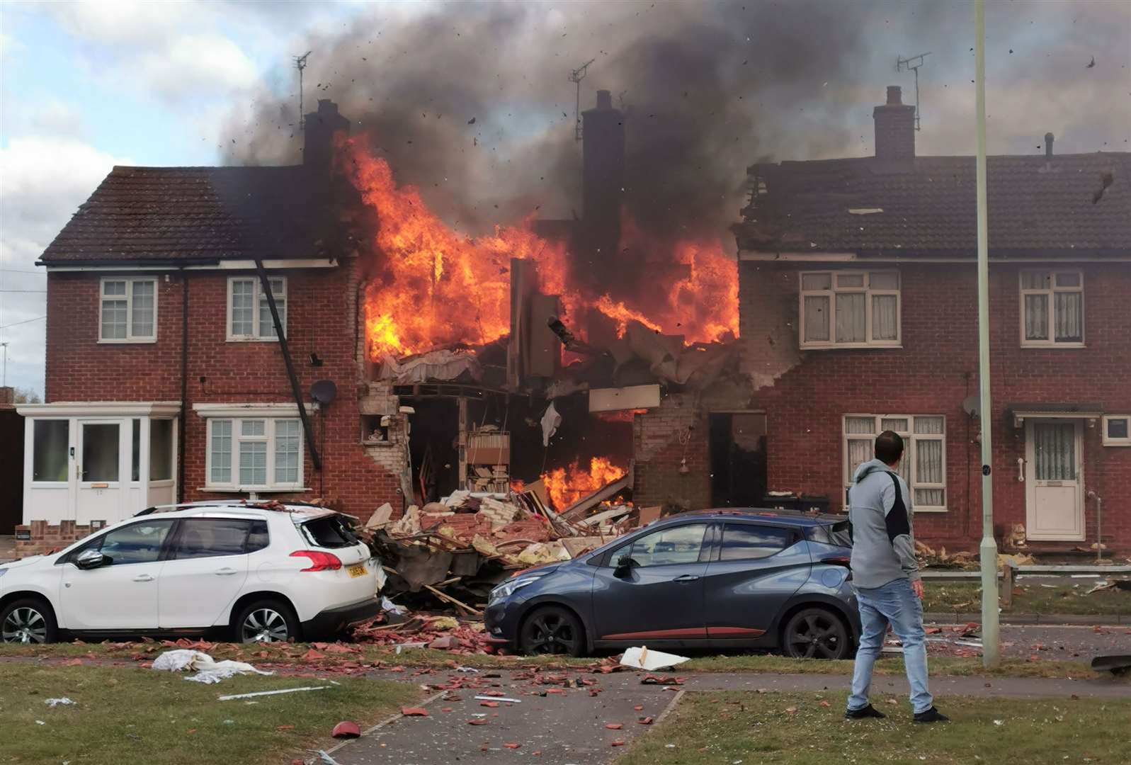 Tuesday's explosion left a home completely raized to the ground and two people with serious injuries