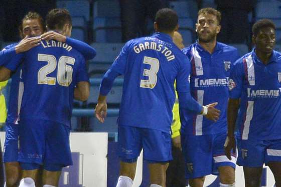 Celebrations after Bradley Dack (left) wins it for Gills with seven minutes left Picture: Barry Goodwin