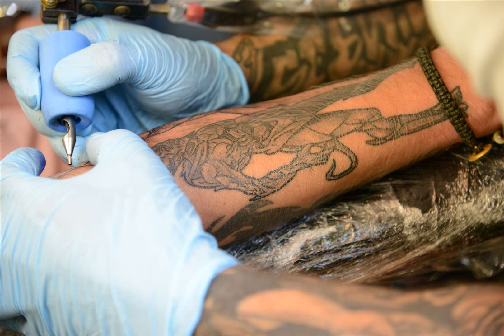A tattoo artist at work