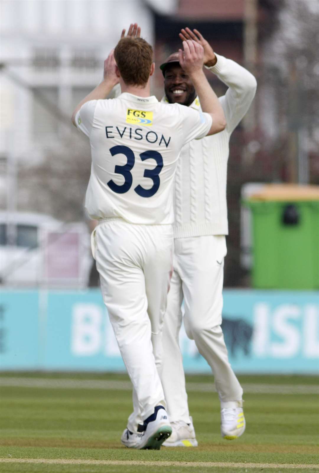 Joey Evison celebrates taking the final Northamptonshire wicket with Daniel Bell-Drummond - his fifth of the match. Picture: Barry Goodwin