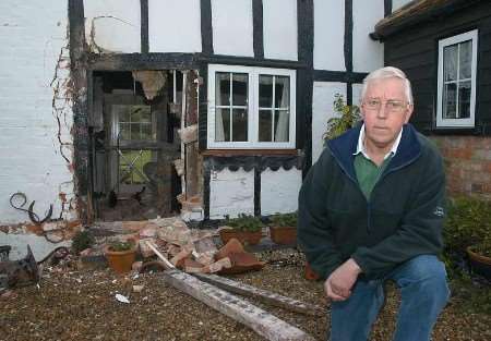 Roy Lincoln in front of his damaged property . Picture: BARRY DUFFIELD