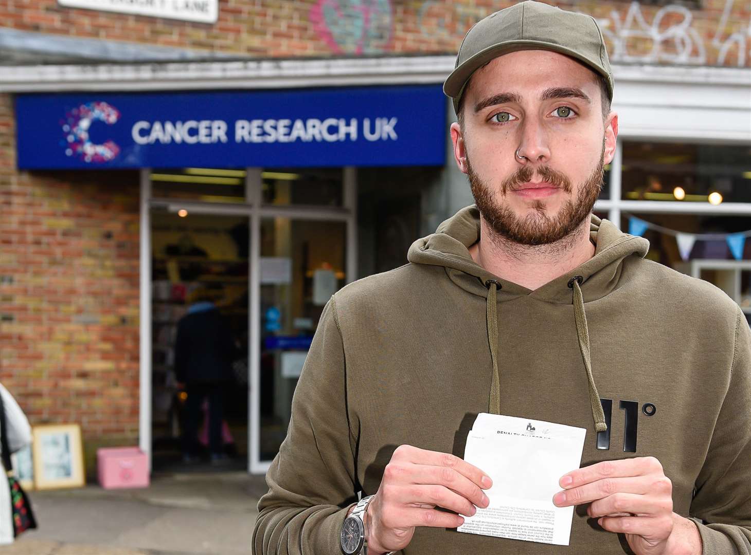 Steven Gillham was given a parking ticket while donating to the Cancer Research charity shop in Canterbury. Picture: Alan Langley