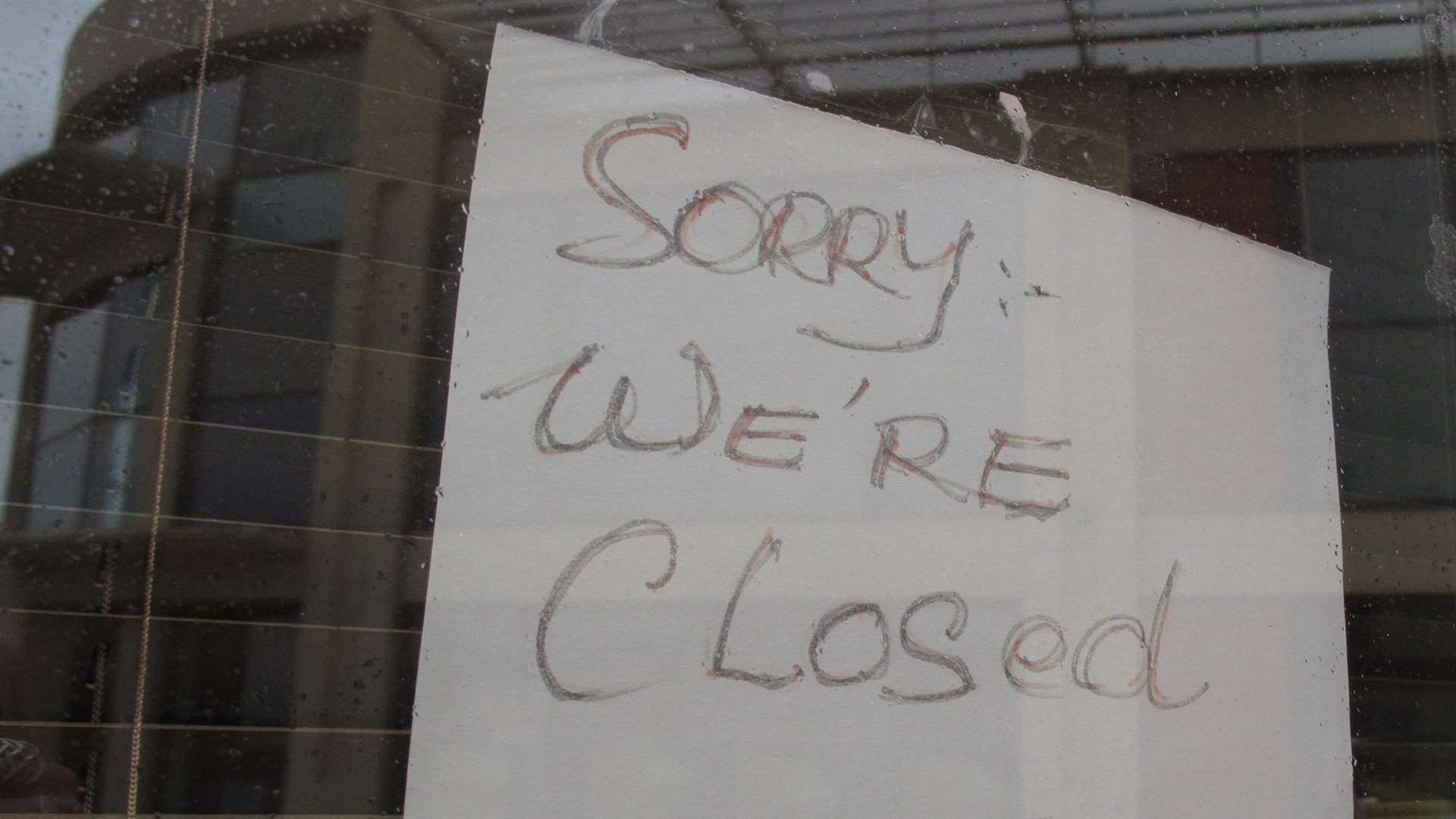 Signs in the window of Memphis Bar reveal is has closed