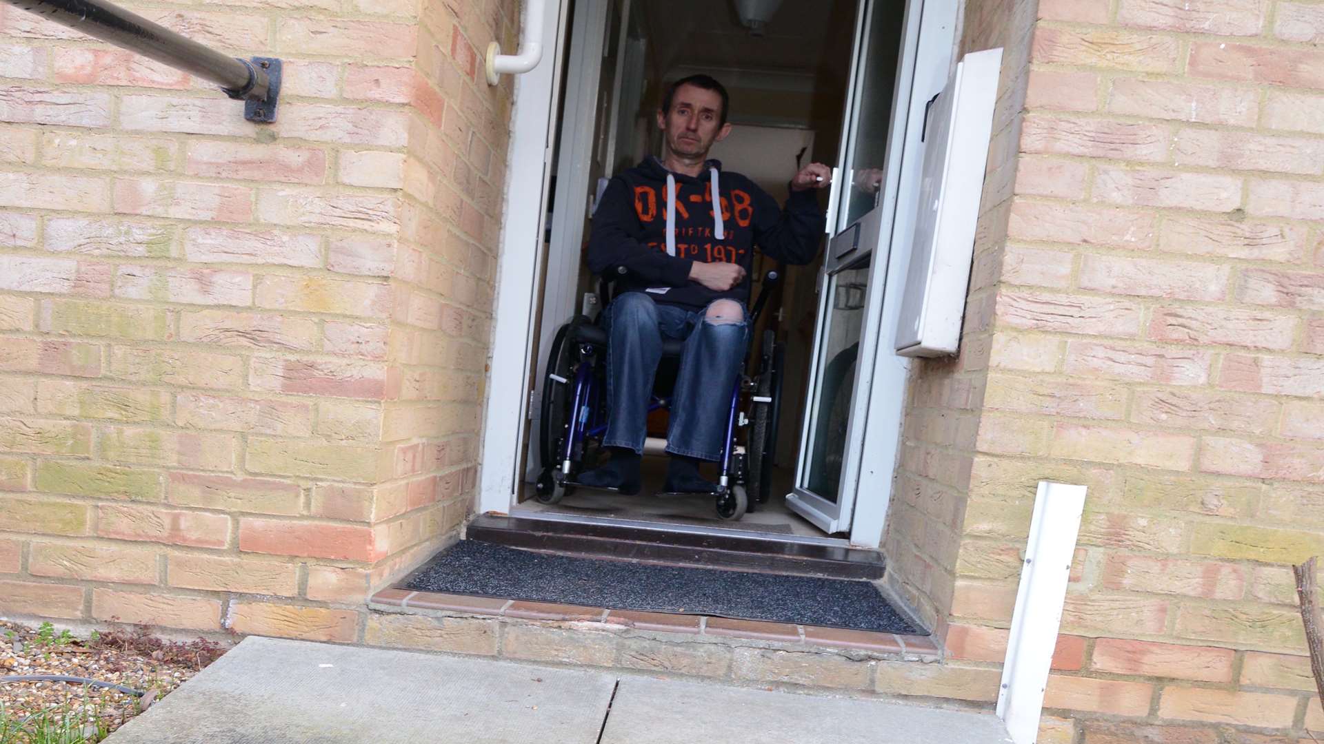 Dan has to pull his heavy buggy over the steps, despite being unable to stand for long