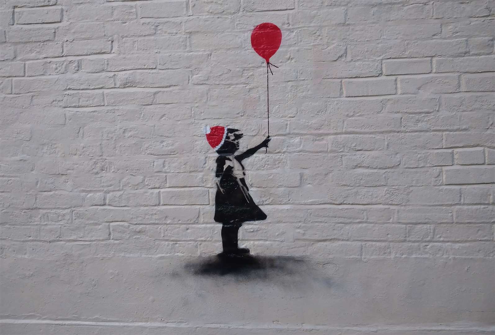 The 'Banksy' artwork is in Sandwich's Three Kings Yard alleyway