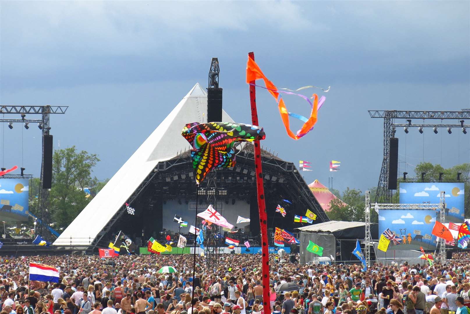 The Glastonbury Festival has changed massively over the years - both in scale of the crowds and number of flags