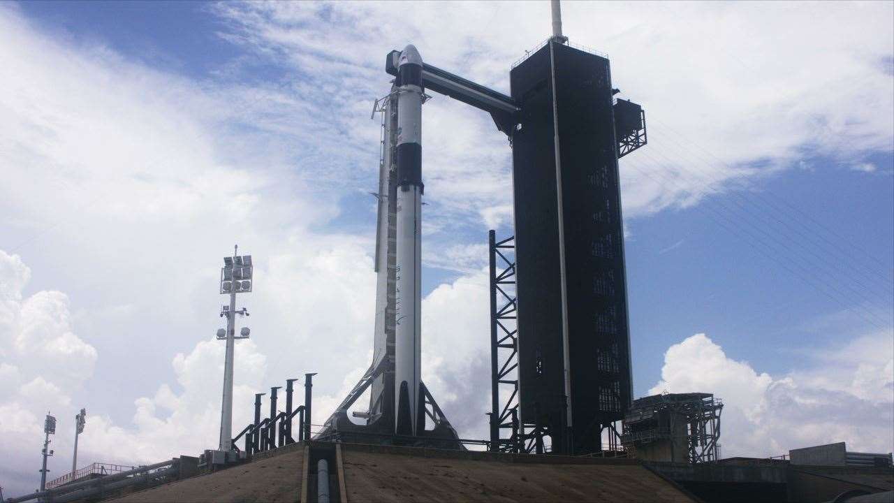 SpaceX Falcon 9 rocket and Crew Dragon stand at Launch Complex 39A on May 27, 2020 ahead of NASA’s SpaceX Demo-2 launch. Image credit: NASA TV