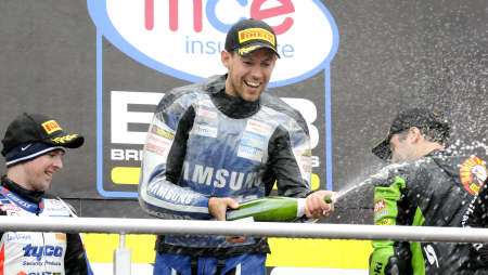 Jon Kirkham celebrates on the podium at Brands Hatch
