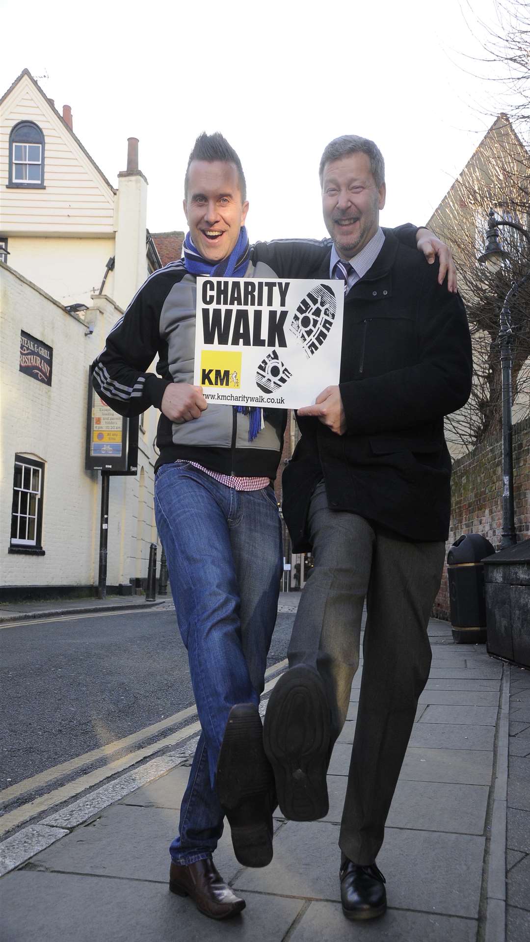 Phil 'Mister Maker' Gallagher steps out with Simon Dolby of the KM Charity Team to promote the KM Charity Walk on June 28.