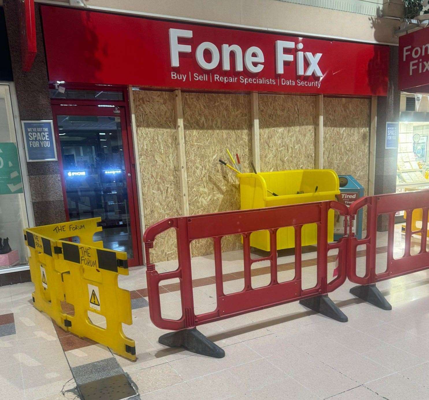 Fone Fix, The Forum Shopping Centre, has been boarded up after its window was smashed during a burglary. Picture: Georgia Oliver