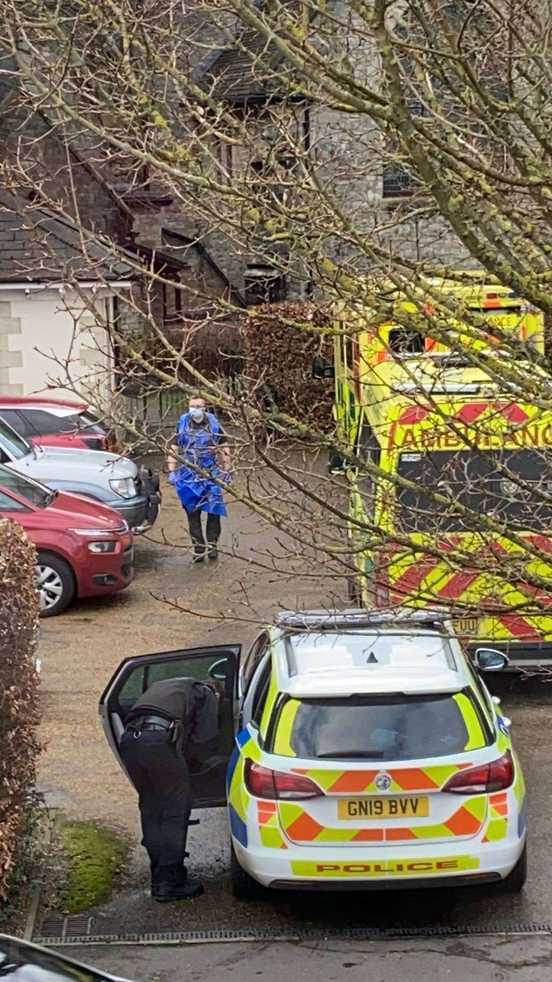 Police officers wore armour and used a battering ram and crow bar as they entered flats in Barming. Picture: Anthony Spencer