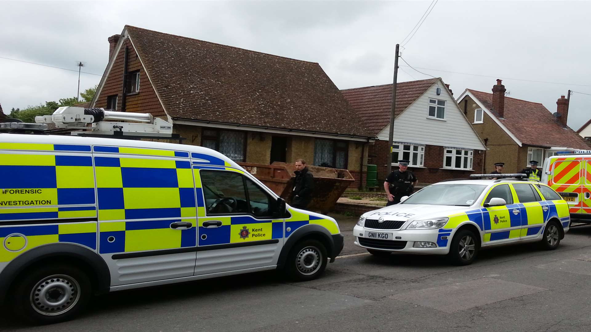 Police vehicles outside the property in Detling