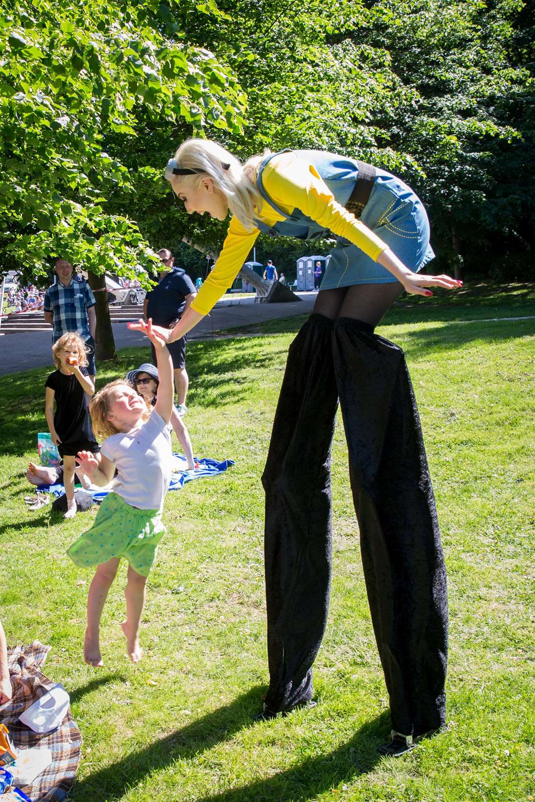 Tall Minion Leanne Faulkener high fives Anna Messon at a previous proms. Picture: Matthew Walker