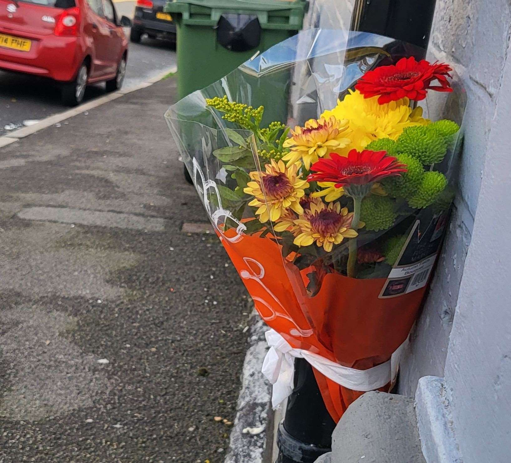 A floral tribute was placed at the scene in New Street, Folkestone