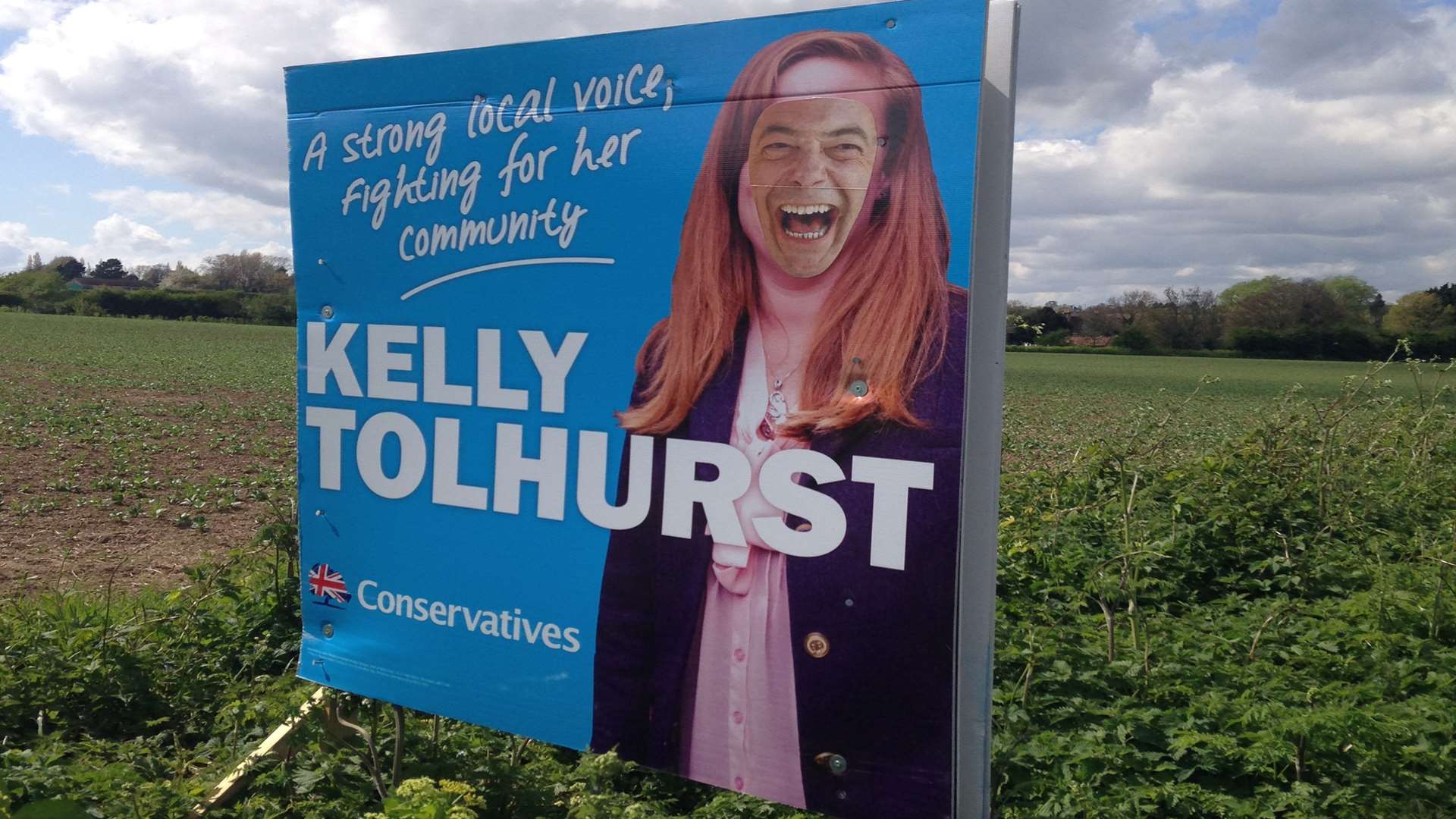 Nigel Farage's face has been put on top of Kelly Tolhurst's election sign.