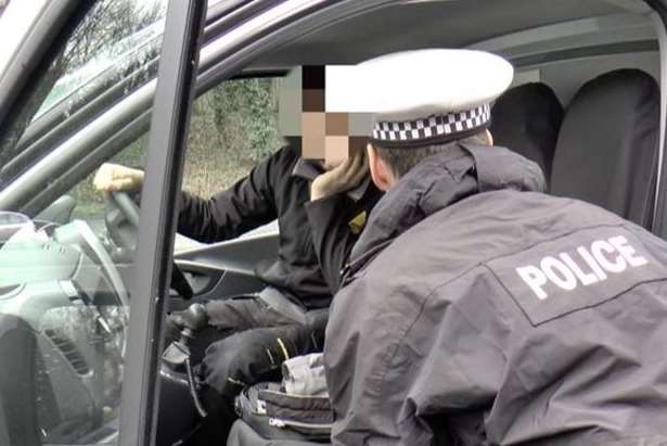 A driver caught on his mobile in a recent crackdown