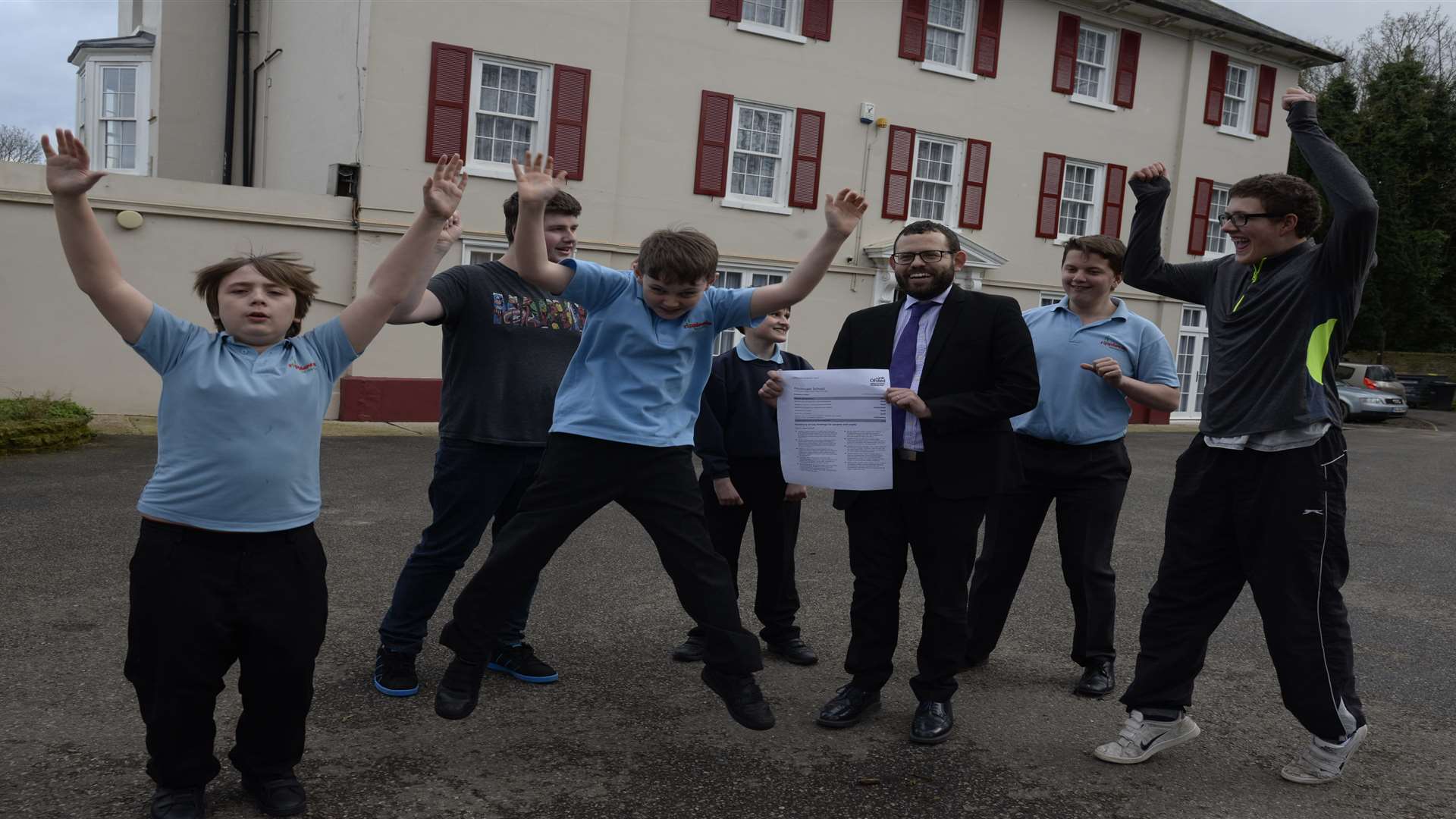 Head teacher Antony Clements and some of his pupils at Ripplevale School celebrate the good Ofsted report