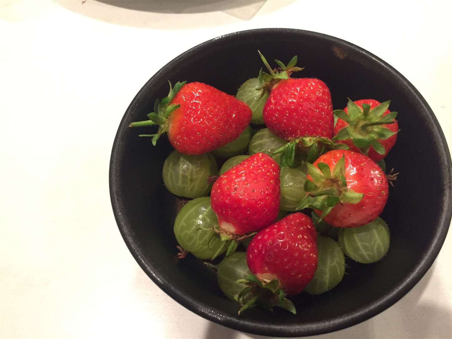 A very fresh breakfast of strawberries and gooseberries