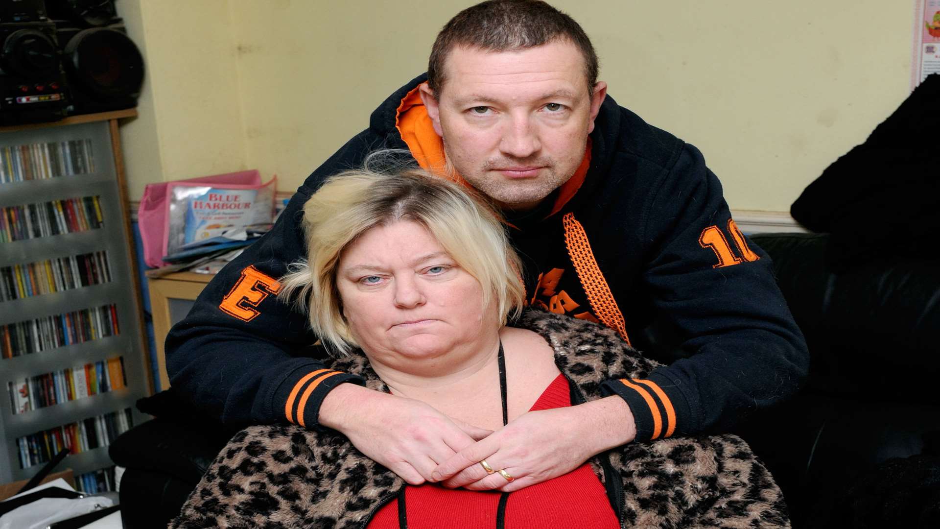 Disabled woman Debbie Stiff who is fighting a compensation claim with KCC after falling on a pavement in Dartford. With her husband Gary. Picture: Simon Hildrew