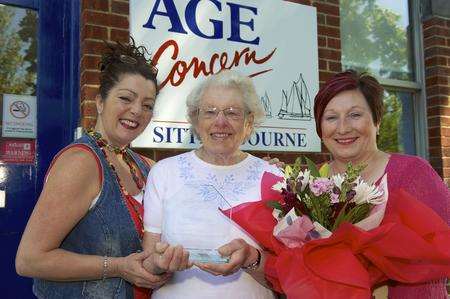 From left, Abigail Reynolds, daycare supervisor, Florence Lockyer with her award, and Chief Officer Tina Booth, outside Age UK, Sittingbourne.