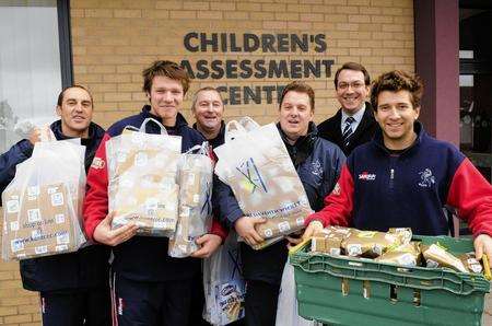 Players and officials from Kent County Cricket Club visit children at the Kent and Canterbury Hospital bearing gifts