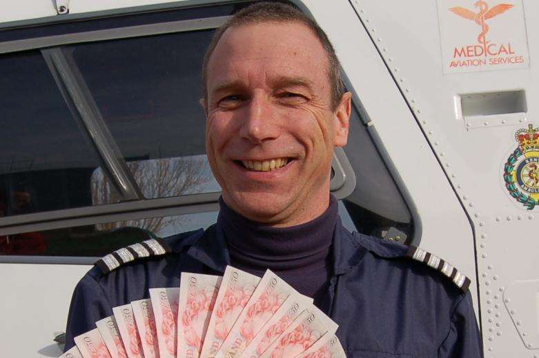 Air Ambulance Pilot, Captain Kevin Goddard flashes the cash.