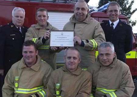 The five firefighters with RSPCA officials