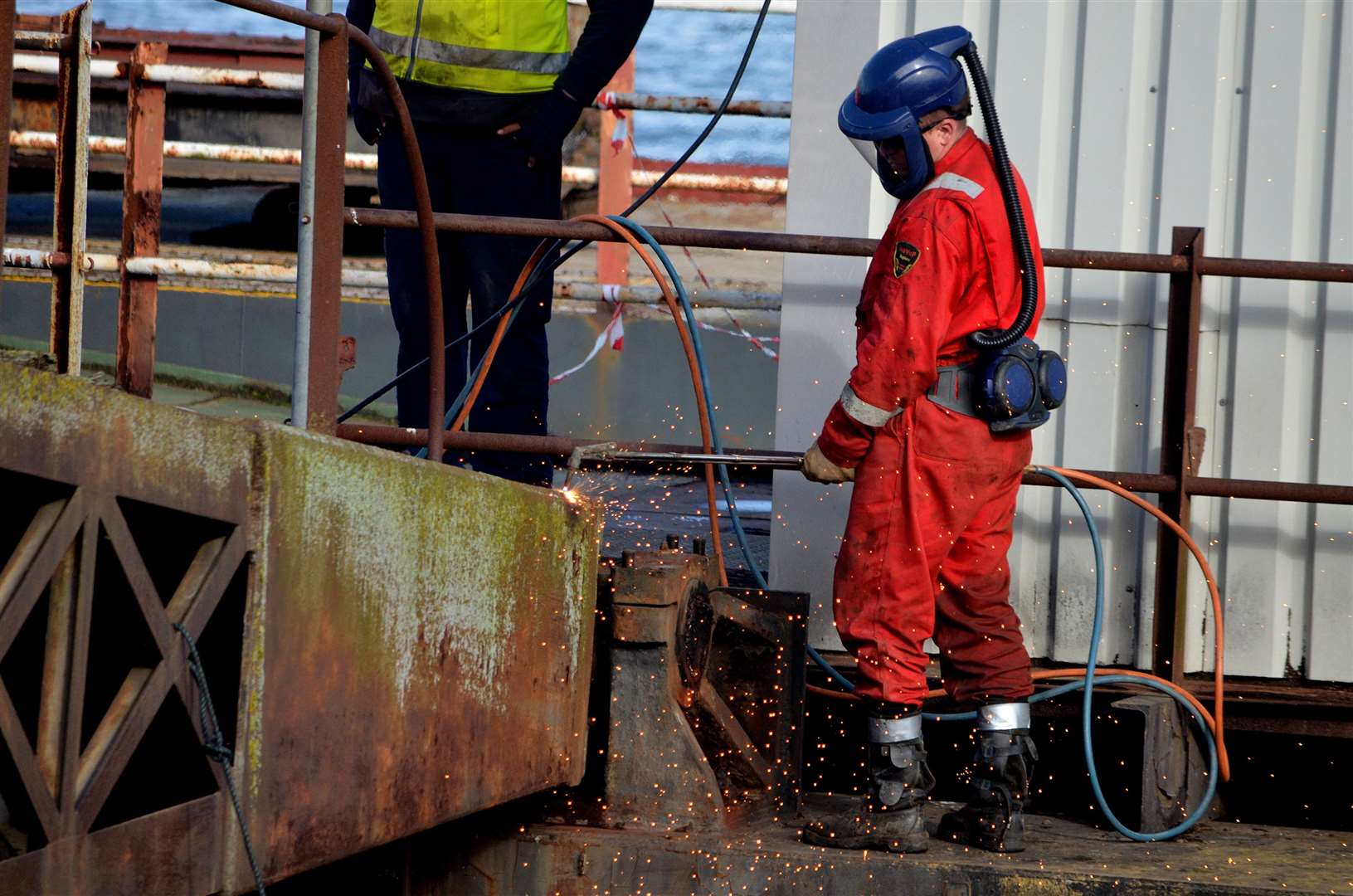 A worker sets apart dismantling part of the disused pier. Photo Credit: Jason Arthur. (18945357)