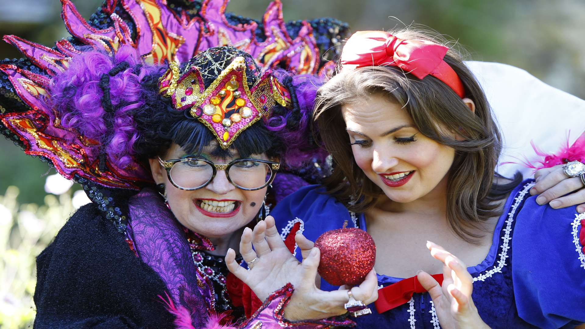 Su Pollard as the Wicked Queen tries to tempt Snow White (Millie Booth) at the panto launch