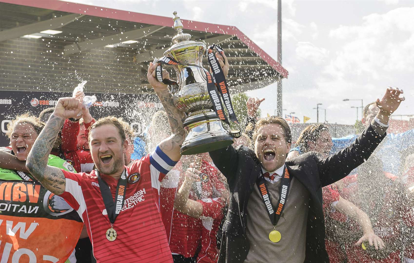 Daryl McMahon lifts the play-off trophy with Danny Kedwell Picture: Andy Payton