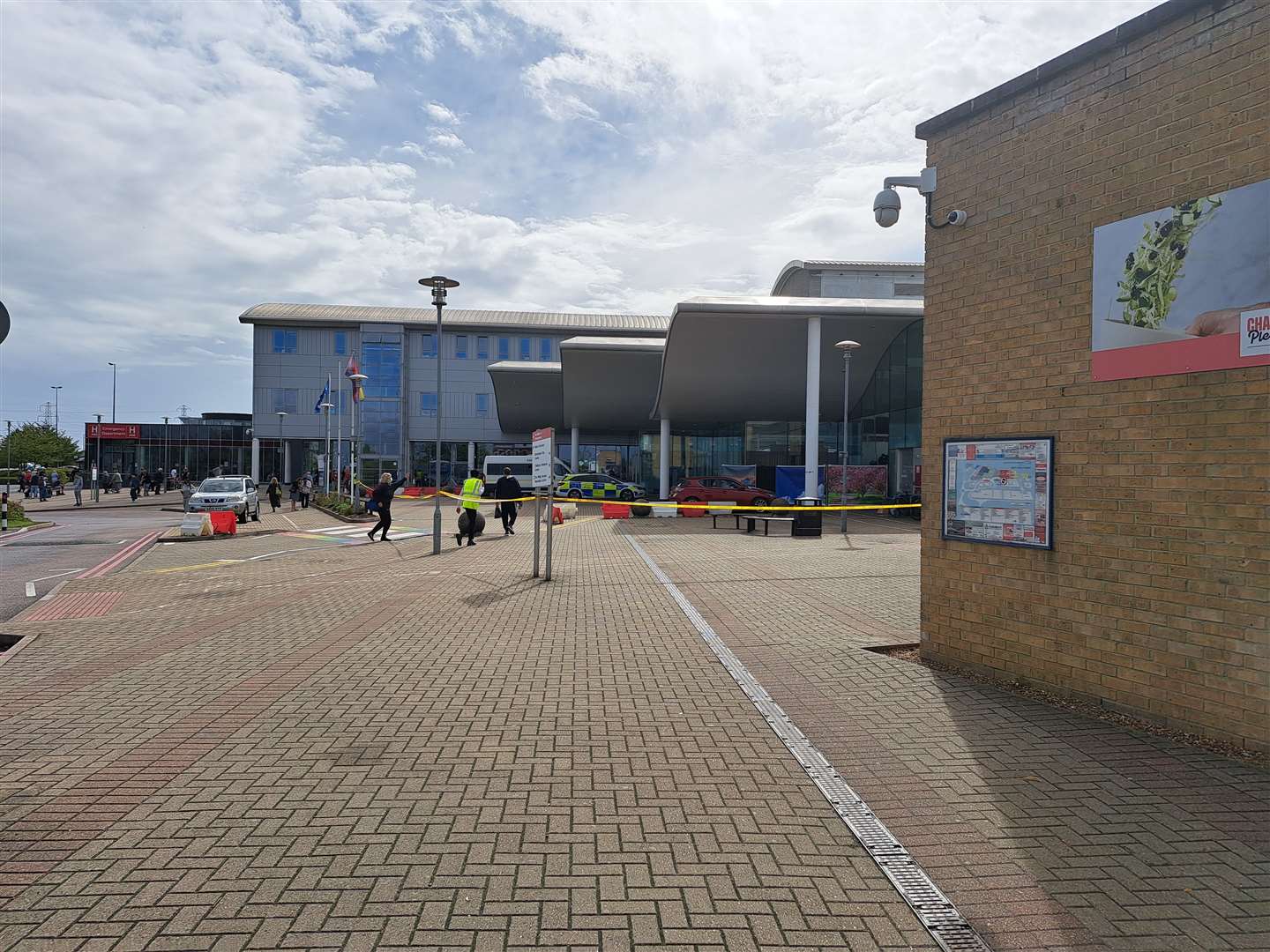 The area around the main entrance at Darent Valley Hospital has been cordoned off after a car smashed through the glass this morning