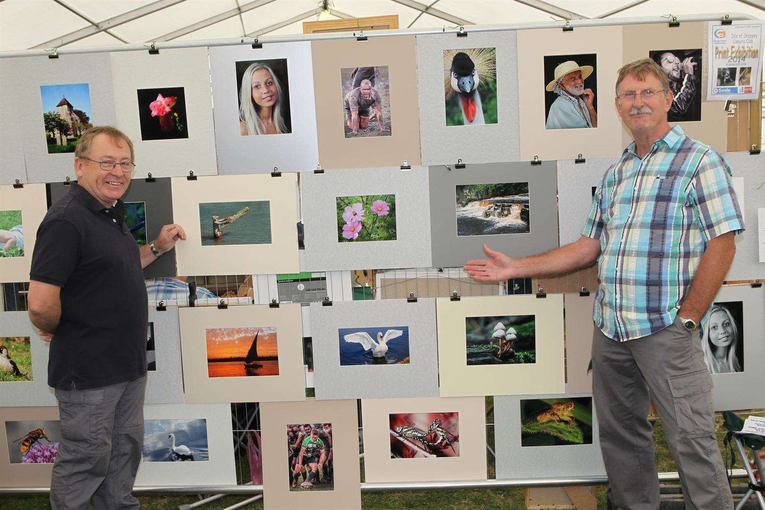 Harry Slack and Tony Clayton from the Isle of Sheppey Camera Club with many examples of the club's work at the Love Sheppey event