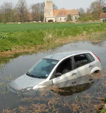 The car was quickly filling up with water. Picture: BARRY DUFFIELD